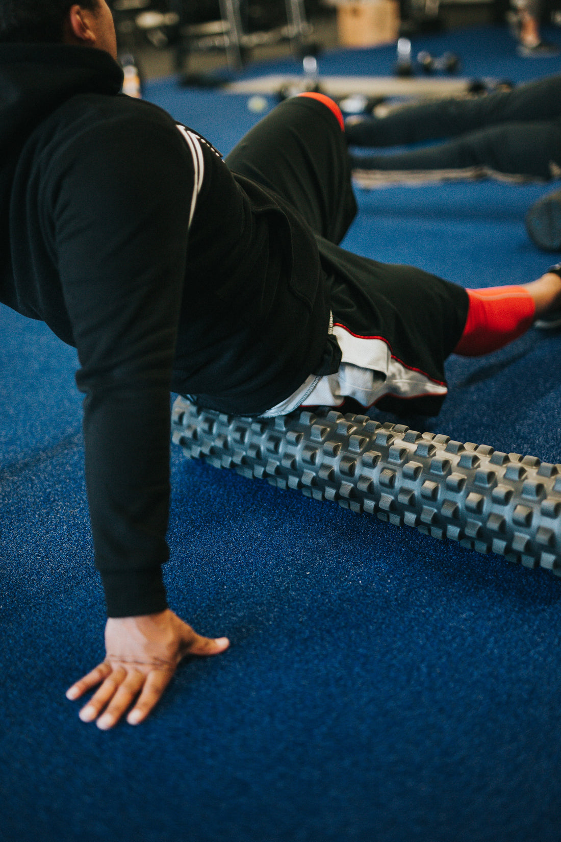 man on roller in sports gym Photo by Andrew Valdivia on Unsplash