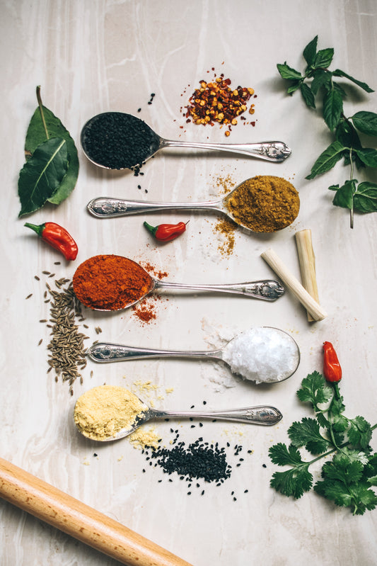 herbs and spices w/ spoons Photo by Calum Lewis on Unsplash