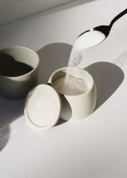 picture of sugar on a spoon (Photo by Mathilde Langevin on Unsplash)