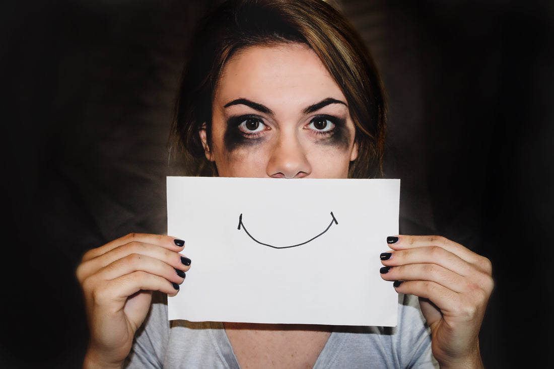 person holding paper of smily face photo by  Sydney Sims on Unsplash